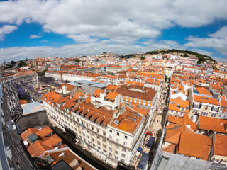 Fototapeta na wymiar Aerial view on Buildings and street in Lisbona, Portugal. Orange roofs in city center