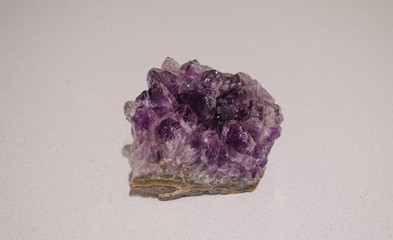 Beautiful and purple amethyst gemstone closeup.