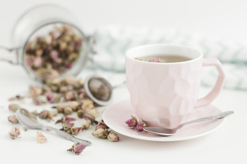 Pink cup with rose tea. Herbal drink