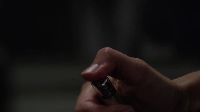 hand large ignites the lighter