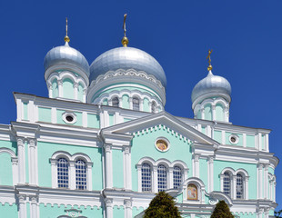 Fototapeta na wymiar white stone Church Cathedral against the blue sky in summer in Sunny weather