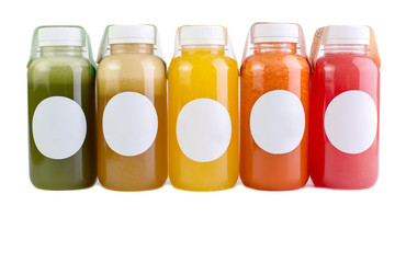 Colorful juices, smoothies, milkshakes in plastic bottles isolated on white background, top view. - Image