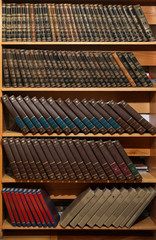 Wooden cabinets with collection of books in library