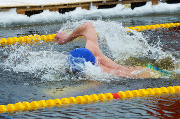 Lovers of winter swimming.Swimmer swims in the pool.