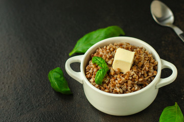 buckwheat porridge and a piece of butter (delicious food) homemade dish. food background. top