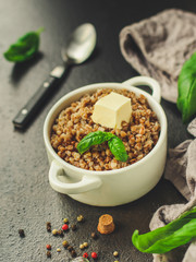 buckwheat porridge and a piece of butter (delicious food) homemade dish. food background. top