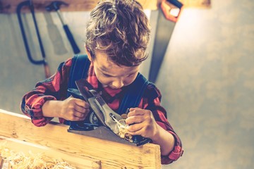 Child fathers day concept, carpenter tool,  home.