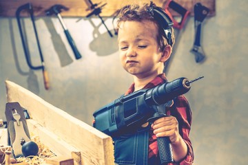 Child fathers day concept, carpenter tool,  worker. - obrazy, fototapety, plakaty
