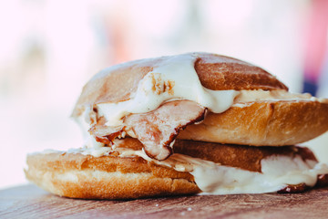 grilled ham and cheese sandwich on wooden background