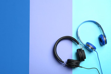 Stylish headphones on color background, flat lay. Space for text