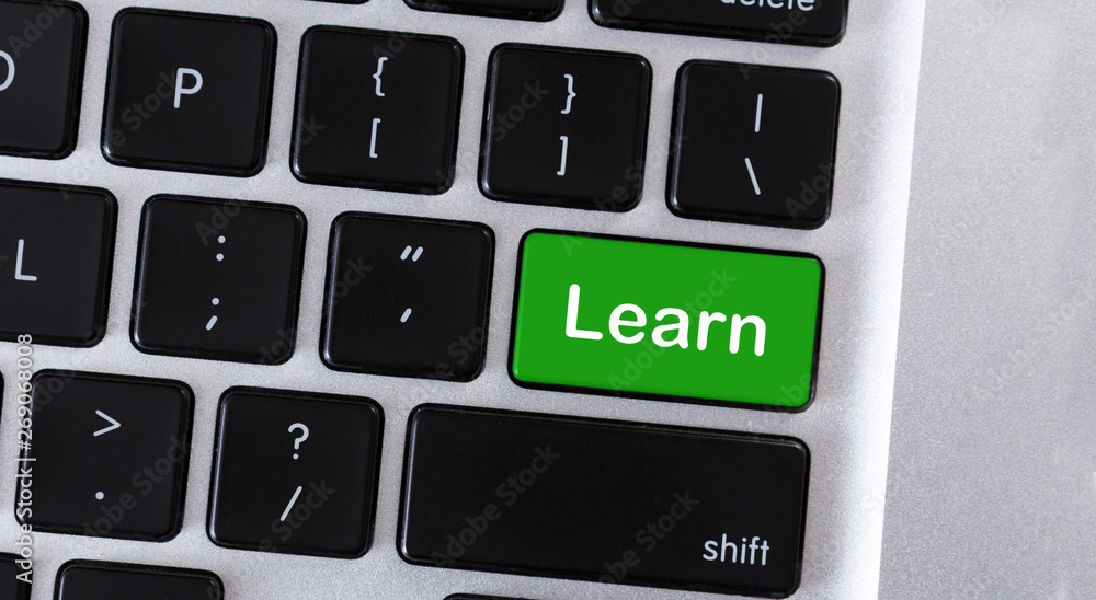 Leinwandbilder Computer keyboard with text Learn on green key