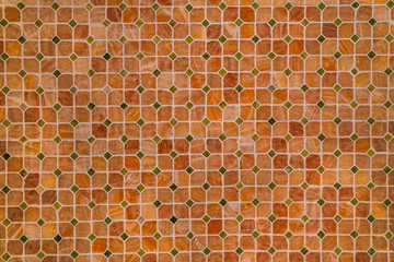 Mosaic tile wall in bathroom. Amber ceramic background