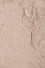 Cosmetic clay powder textured background, close up