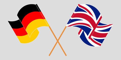 Crossed and waving flags of Germany and the UK