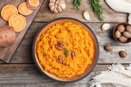 Flat Lay Composition With Mashed Sweet Potatoes On Wooden Background