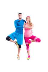 Fototapeta na wymiar Happy young couple doing exercise in pair for pregnancy on the white background.
