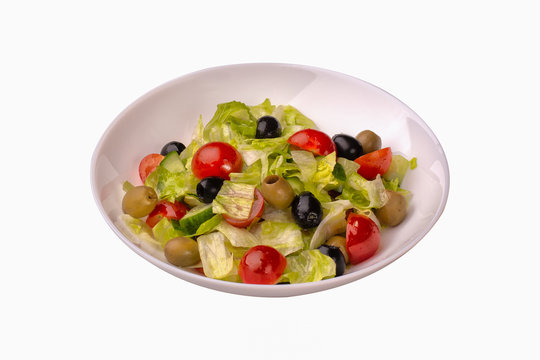 fresh vegetable salad with tomatoes and black olives