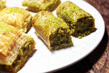 Middle eastern or arabic dishes. Turkish Dessert Baklava with pistachio on dishes