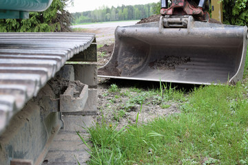 Excavator close up. Focus on shovel. Copy space.