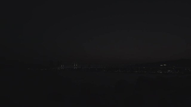 Busan, South Korea - March 2018: time lapse of Gwangalli beach in Busan with sunset and illuminated bridge
