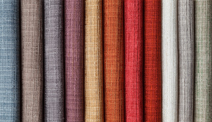 samples of multi-colored fabrics for curtains close-up.