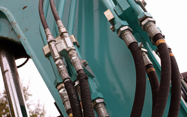 Hydraulic pipes and hoses on excavator.
