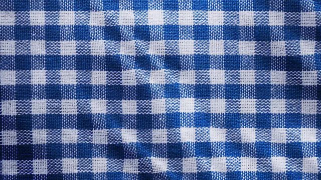 Blue white tablecloth, picnic gingham is waving. Top view checkered fabric cloth background.