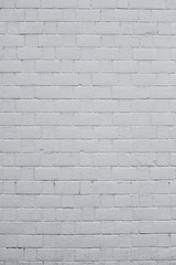 Abstract weathered textured white brick wall background