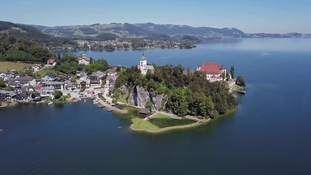 Flight around Traunkirchen church on Traunsee lake, in Salzkammergut, Upper Austria.