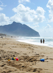 Shoreline under a cloudy sky,  in the background the famous Circeo mountain, Lazio, Italy.