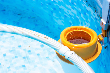 pool cleaner in slightly dirty swimming pool blue water, villa renting apartment summer service 