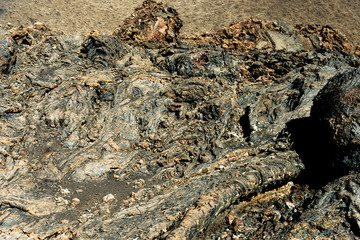 Timanfaya National Park, Lanzarote, Canary Islands, Spain. Unique panoramic view of spectacular lava river flows from a huge volcano crater creates a lunar landscape on planet earth.