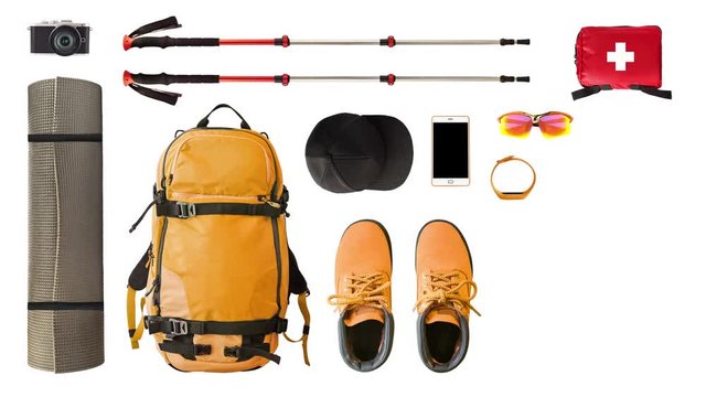 Set of sport equipment and gear for hiking and trekking isolated on white background. Stop motion time lapse