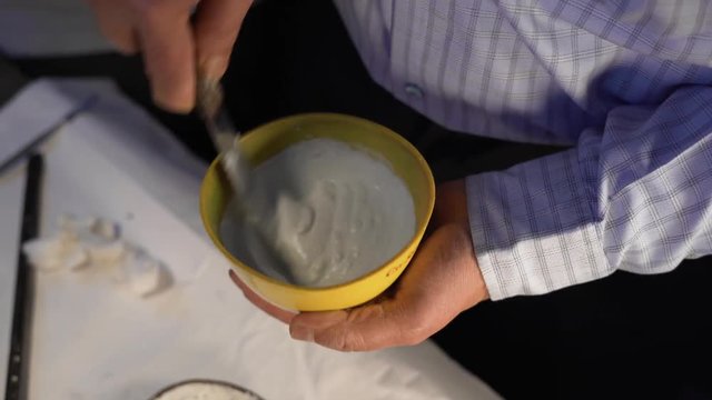 Dental mixture of plaster of paris for flasking denture procedure, close up shot