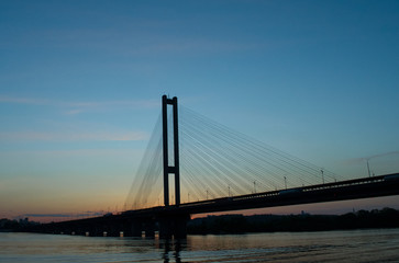 Fototapeta na wymiar silhouette of a bridge at sunset