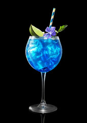 fresh blue cocktail with ice on a black background