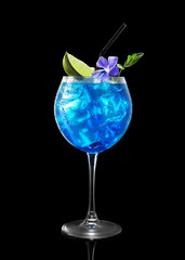 fresh blue cocktail with ice on a black background
