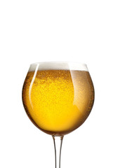 Glass of beer close-up on white background