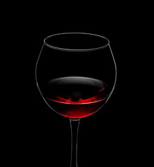 red wine in glass isolated on black