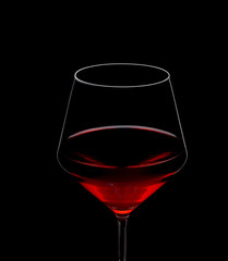 red wine in glass isolated on black