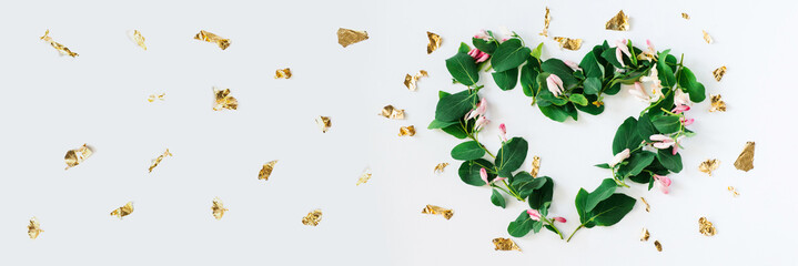 Heart shape made of flowers on white background.Flat lay, banner. Valentines,love and wedding concept ideas