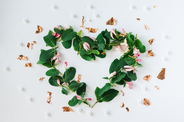 Heart shape made of flowers on white background.Flat lay. Valentines,love and wedding concept ideas
