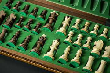 Naklejka premium black and white chess pieces in box chessboard, business strategy concept