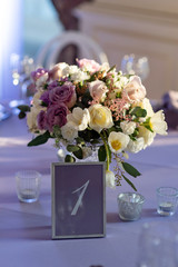 Gentle flowers on a holiday table at restaurant