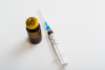 vial with drug and syringe isolated