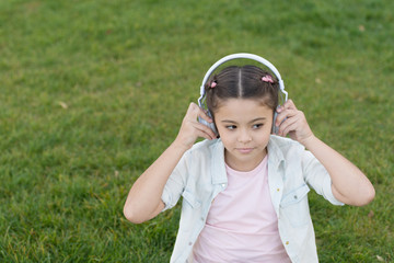 City guide and audio tour. Girl little tourist kid using audio guide mobile application. Audio tour headphones gadget. Free style of travelling. Exciting journeys through cities and museums