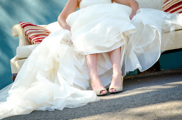 Fototapeta na wymiar Bride Shoes and Wedding Dress