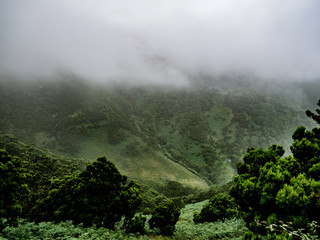 Fototapeta na wymiar Image of foggy and misty mountian landscape