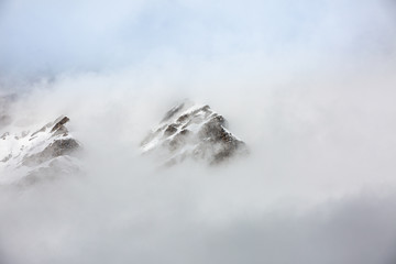 Alps peaks are covered by clouds.