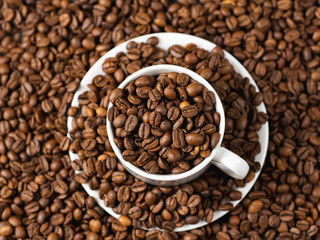White Cup of coffee with coffee beans . Copy space
